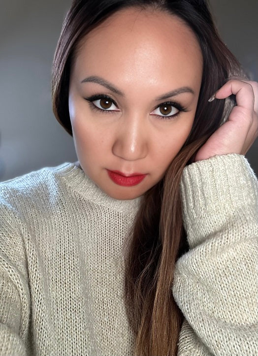 woman wearing cat eye shape strip lashes